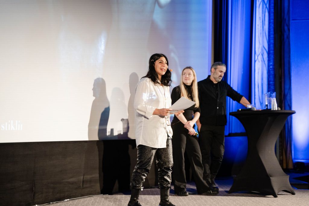 People presenting a project on stage