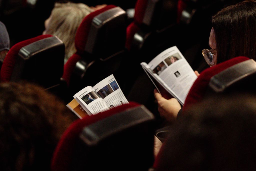 Festival audience reading the programme at a Göteborg Film Festival screening